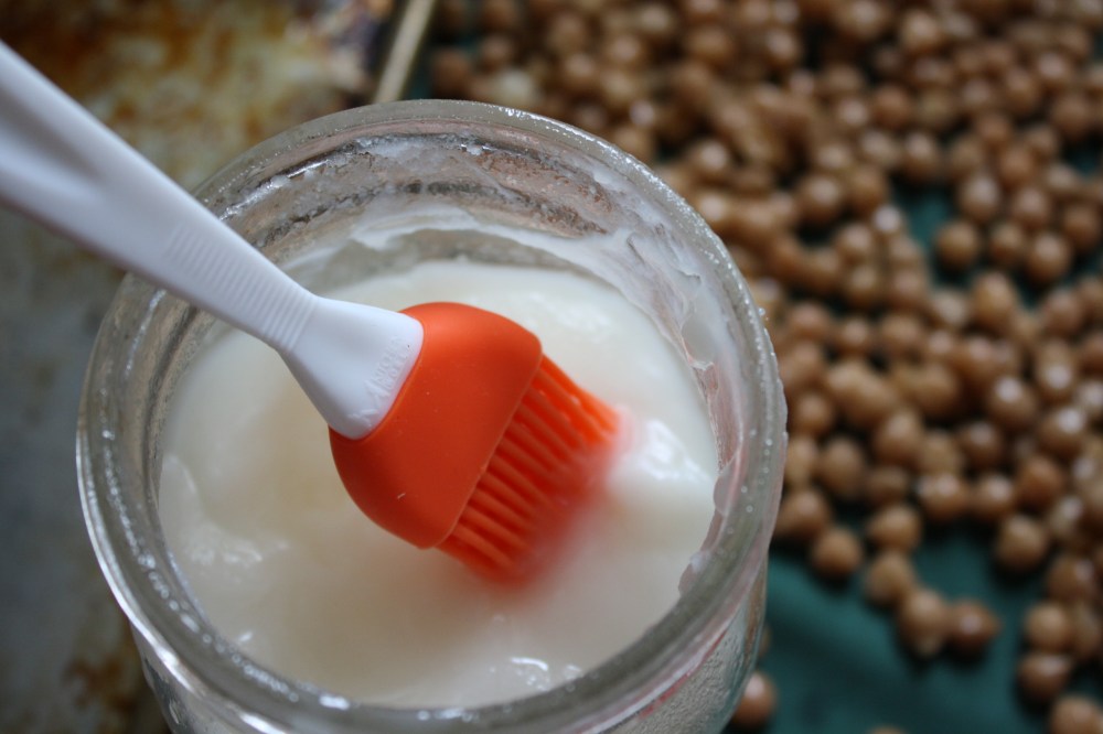 silicone baking brush in jar of lard
